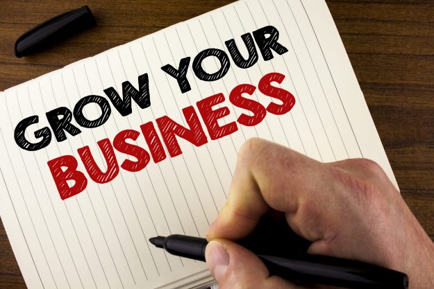 Conceptual Hand Writing Showing Grow Your Business. Business Pho Conceptual hand writing showing Grow Your Business. Business photo showcasing improve your work enlarge company overcome competitors written by Man Notebook Book Wooden background Marker.
