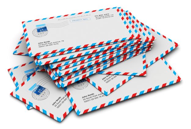 Stack of paper mail letters Stack of paper air mail letter envelopes isolated on white background