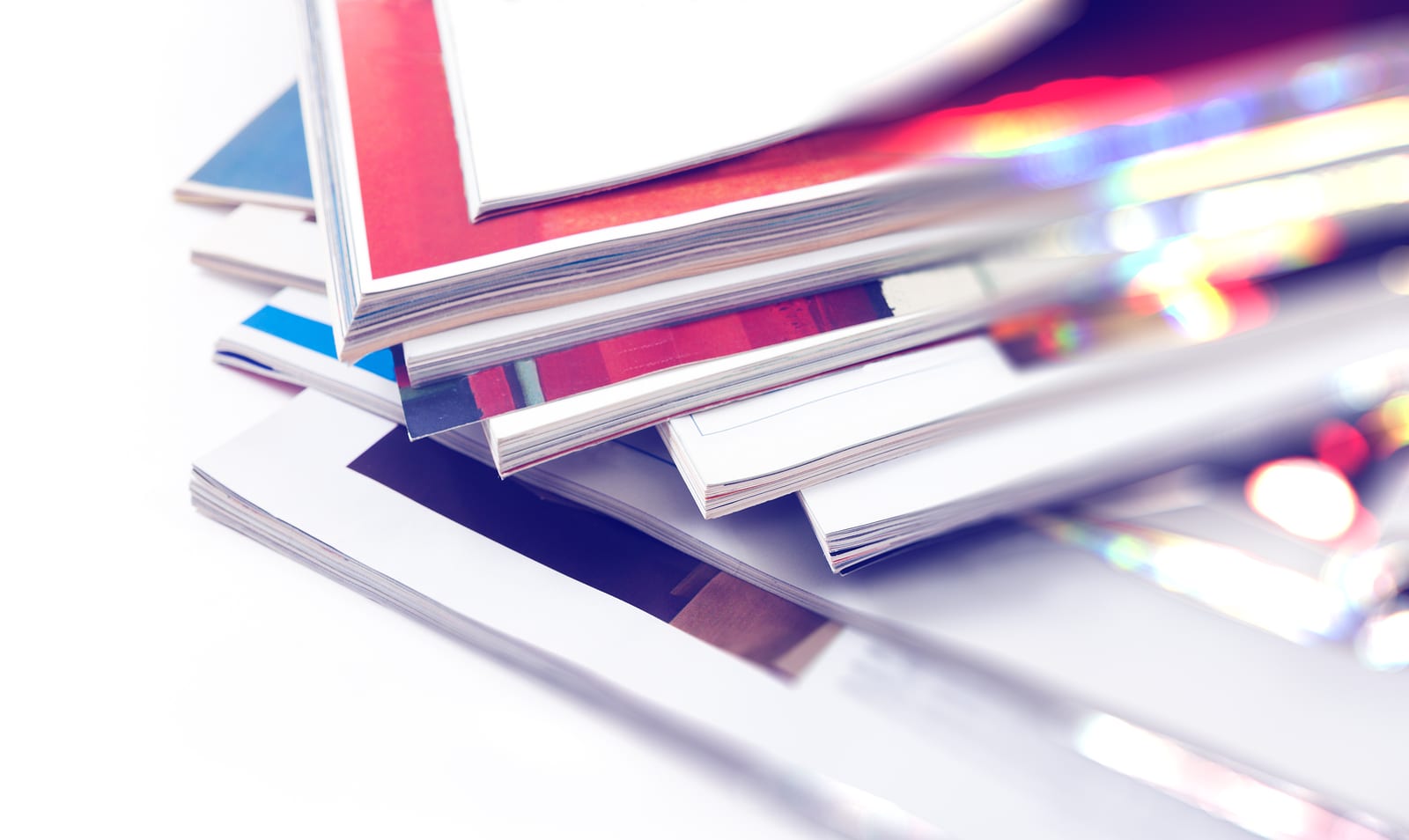 Booklets Close up image of magazines stack background. News and media publications.Magazines heap detail